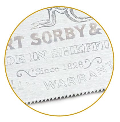 Close-up of a Robert Sorby Kangroo Hand Saw by SOR, showing engraved text: "MADE IN SHEFFIELD", "Since 1828", and "WARRANTED". The toothed edges reflect the precision typical of a classic hand saw.