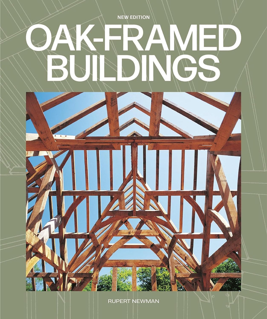 Cover of "Oak-Framed Buildings" by Taunton Press, highlighting timber-frame construction against a blue sky, set on a green background.