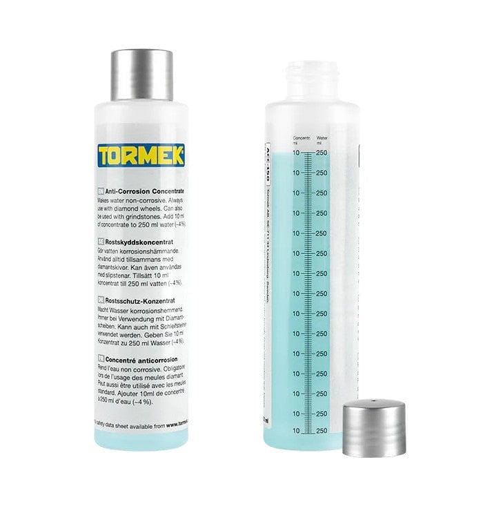 Two clear TOR bottles labeled "Tormek Anti-Corrosion Concentrate" hold blue liquid—one displays instructions, the other has a 0–250 ml scale. Used as a sharpener water trough additive for corrosion protection; silver cap included.