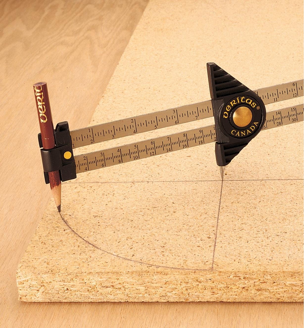 The VER Carpenters Gauge, featuring clear ruler markings and a pencil holder, is used to draw a precise arc on a wooden board when set against the edge.