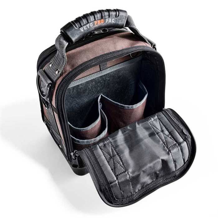 A black and brown VET CLOSED TOP TOOL BAG-MC features a zippered flap open to two inner compartments and a sturdy handle.