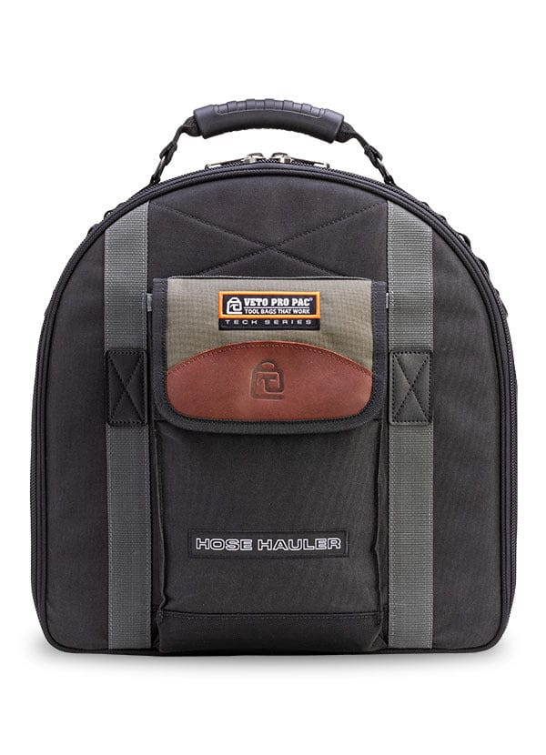 A black, water-resistant VET Hose Hauler tool bag with sturdy handle, gray straps, and brown-tan front pocket. Designed for hose storage or HVAC tools, it stands upright showing the logo and label against a white background.