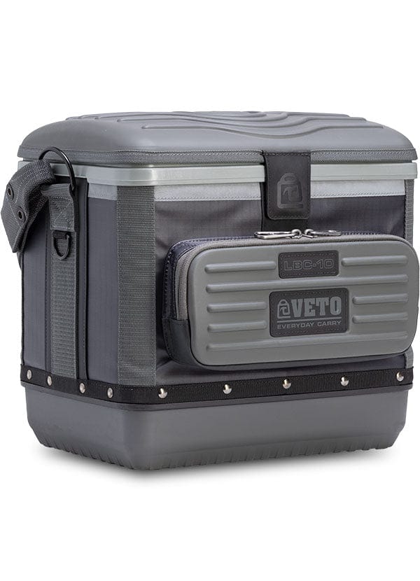 The VET Veto Pro Pac Cooler is a gray, lunchbox-sized bag with a side strap, front pocket labeled "Veto Everyday Carry," and features a magnetic latch for secure closure.