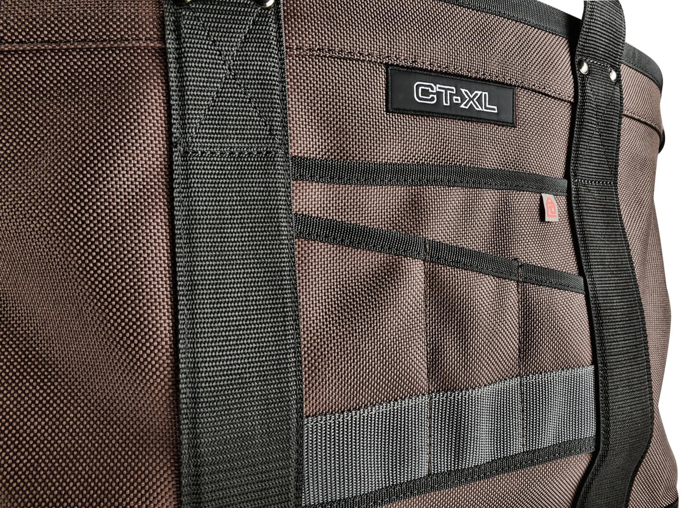 Close-up of a brown VET Cargo Tote with black straps and multiple exterior pockets, showcasing a rugged tote design for high quality tool storage.
