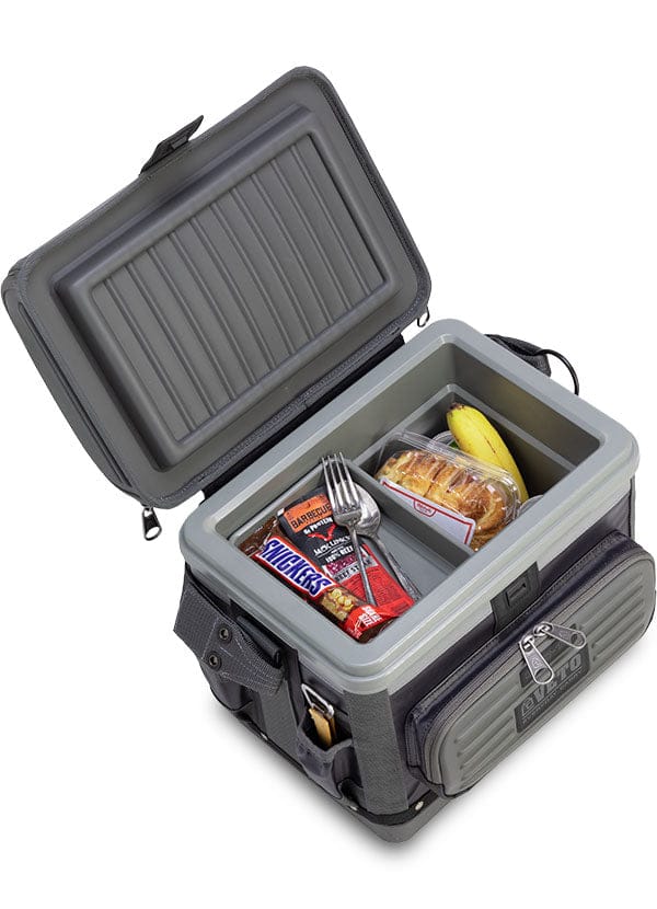 The VET Veto Pro Pac Cooler, the size of a lunchbox, features an open compartment secured by a magnetic latch containing a Snickers bar, Nutri-Grain bar, fork, sandwich in a plastic container, and a banana.