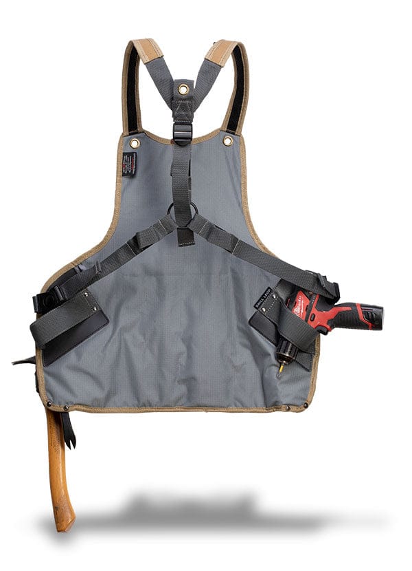 The VET Veto Tool Apron is crafted from durable gray polyester canvas and features black straps, a hammer loop, and chest pockets. It also includes a holster ideal for holding a red power drill.
