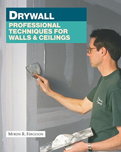 Wearing a dark shirt, an individual applies drywall compound to a wall with a putty knife, while "Drywall: Professional Techniques for Walls & Ceilings" by Taunton Press is prominently displayed on the cover, highlighting new tools and materials for efficient drywall installation.
