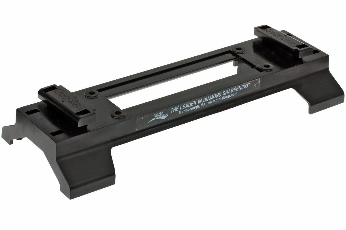 A black plastic holder with adjustable clamps and a clear center, designed to secure DMTs DuoSharp PLUS Bench Diamond Stone. Labeled The leader in diamond sharpening.