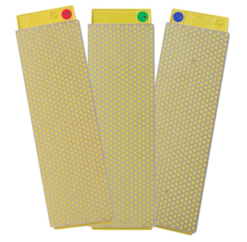 The DMT DuoSharp PLUS Bench Diamond Stones are three yellow rectangular sharpeners with rounded corners, polka-dot surfaces, and colored dots (red, green, blue) with matching top tabs to show grit type.