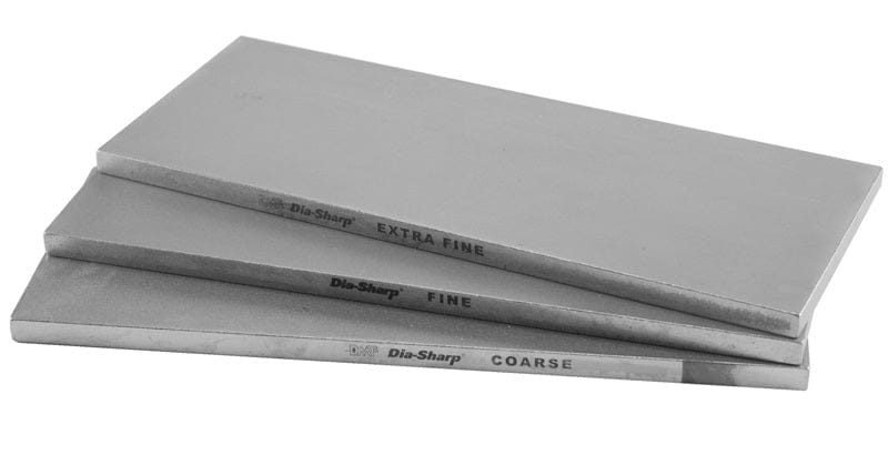 Three rectangular DMT Dia-Sharp Diamond Bench Stone 10-in sharpeners labeled EXTRA FINE, FINE, and COARSE are stacked, each with a continuous diamond surface offering different grit levels for sharpening or honing blades.
