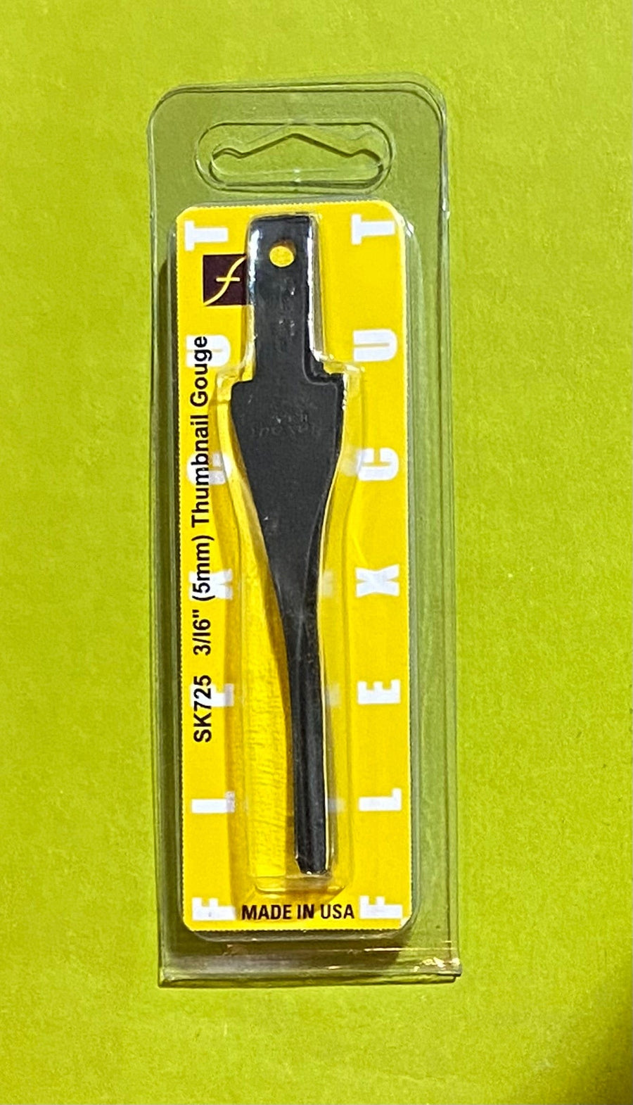 A FLE Flexcut Thumbnail Gouge Blade (3/16, 5mm) in black, sealed in clear plastic packaging with a yellow and white backing card, labeled MADE IN USA.
