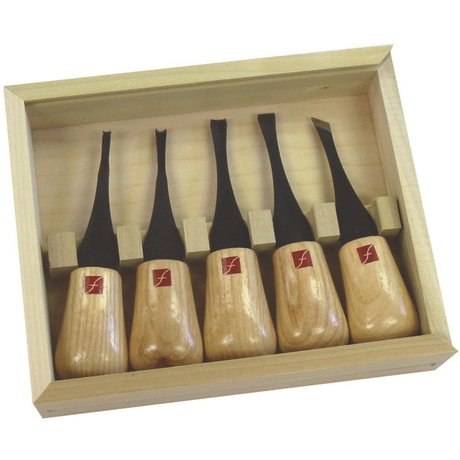 The Flexcut Beginners Palm Set by FLE consists of five high carbon steel wood carving chisels with wooden handles, neatly arranged in a wooden box for storage, making it perfect for novice carvers.