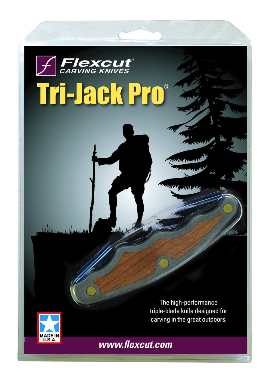 The FLE Tri-Jack Pro carving knife, with its ergonomic Pistol Grip design, is presented in packaging featuring a hiker with a walking stick and trees. Crafted from aerospace-grade aluminum, it's a premium tool ideal for outdoor enthusiasts seeking precision and durability.
