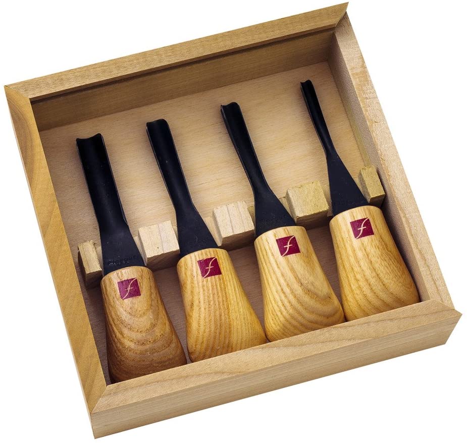The FLE Set of Four Thumbnail Gouges features ergonomic wooden handles, each labeled with a red square, and dark high carbon steel blades—presented in a wooden box.