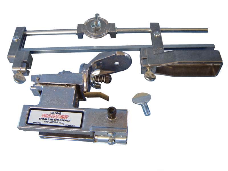 The Granberg File-N-Joint Chainsaw Sharpener, featuring a silver metallic finish, various components, and a single screw along with a file holder, is displayed on a white background. MADE IN THE USA.