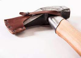 Close-up of the GRF Gransfors Bruk Splitting Maul W/ Collar Guard 450, featuring a light wooden handle and dark metal head, partially covered by a brown leather sheath, designed for efficient wood splitting on a white background.