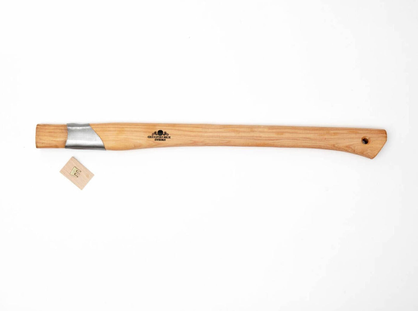 GRF's Gransfors Bruk Small Splitting Axe 441, featuring a wooden hickory handle with a metal-reinforced top and a small drilled hole at the bottom, is displayed on a white background. A small paper tag is positioned to the left of the handle. The axe comes with a grain-leather sheath for protection and convenience.