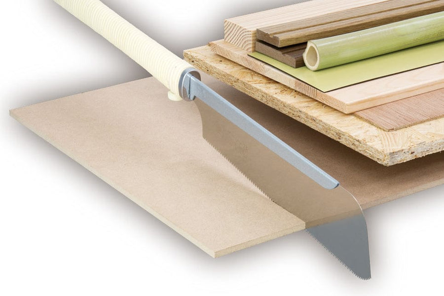 The BBT Razarsaw Panel Saw 240mm, featuring a traditional rattan handle, rests on stacked boards—plywood, solid wood, and bamboo—showcasing essential tools for precision carpentry and detailed craft work against a white background.