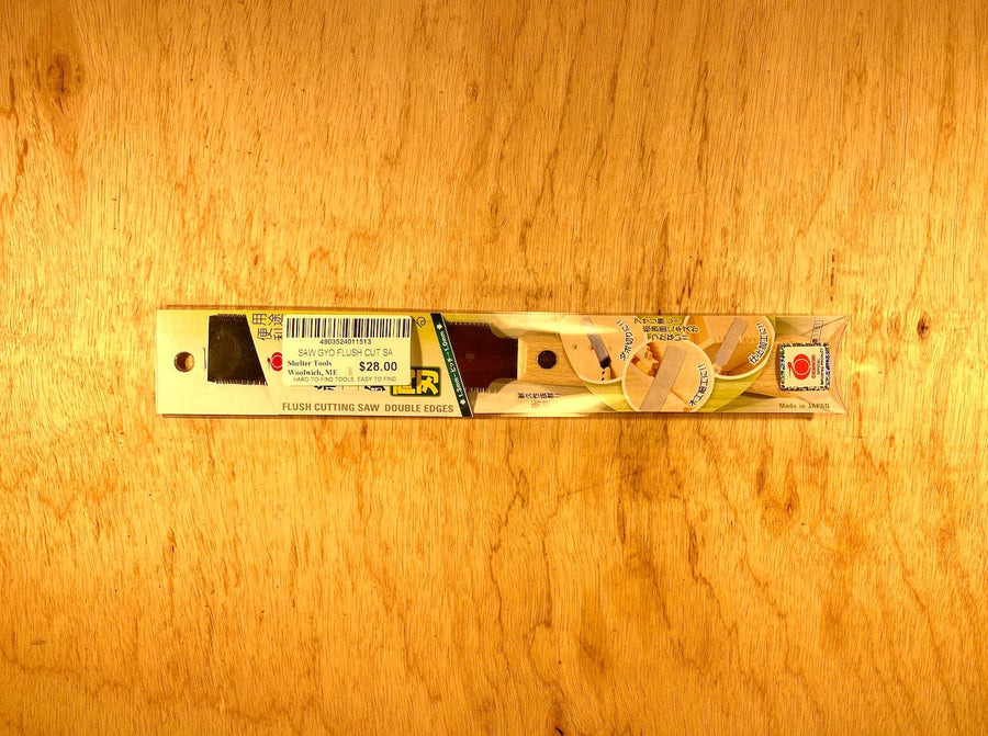 The BBT Gyokucho Flush Cutting Saw Double Edge, priced at $28.00, rests elegantly on a beech wood surface, featuring double edges and cross-cut teeth.