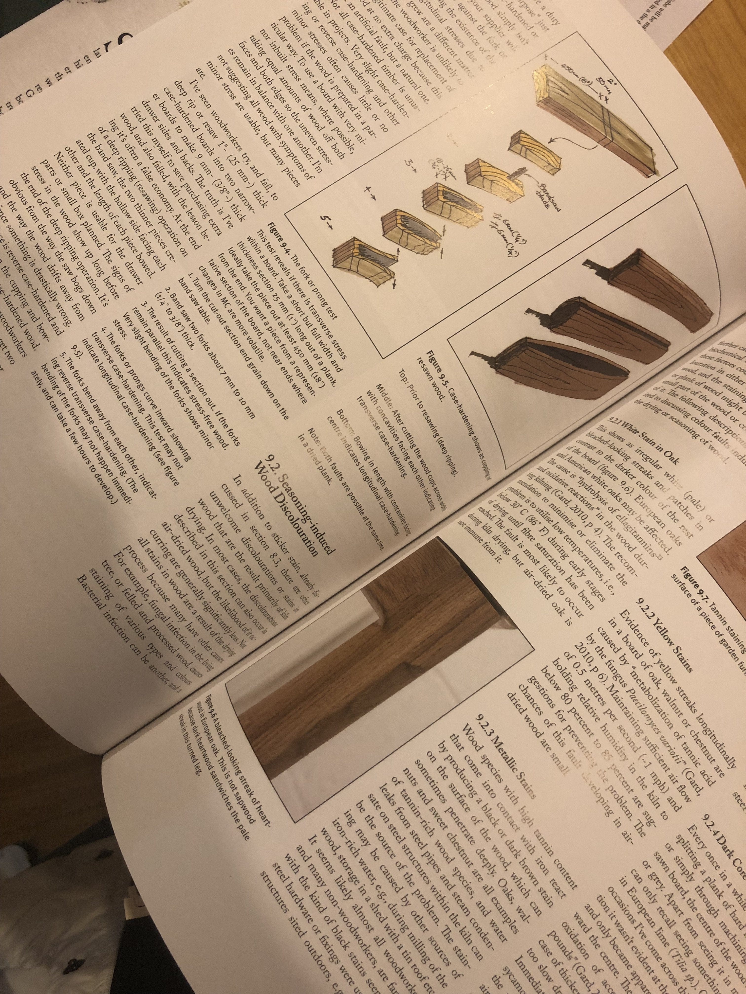 An open Cut & Dried - A Woodworkers Guide to Timber Technology by LAP displays timber technology instructions, wooden joint diagrams, and finished wood piece photos on a wooden table.