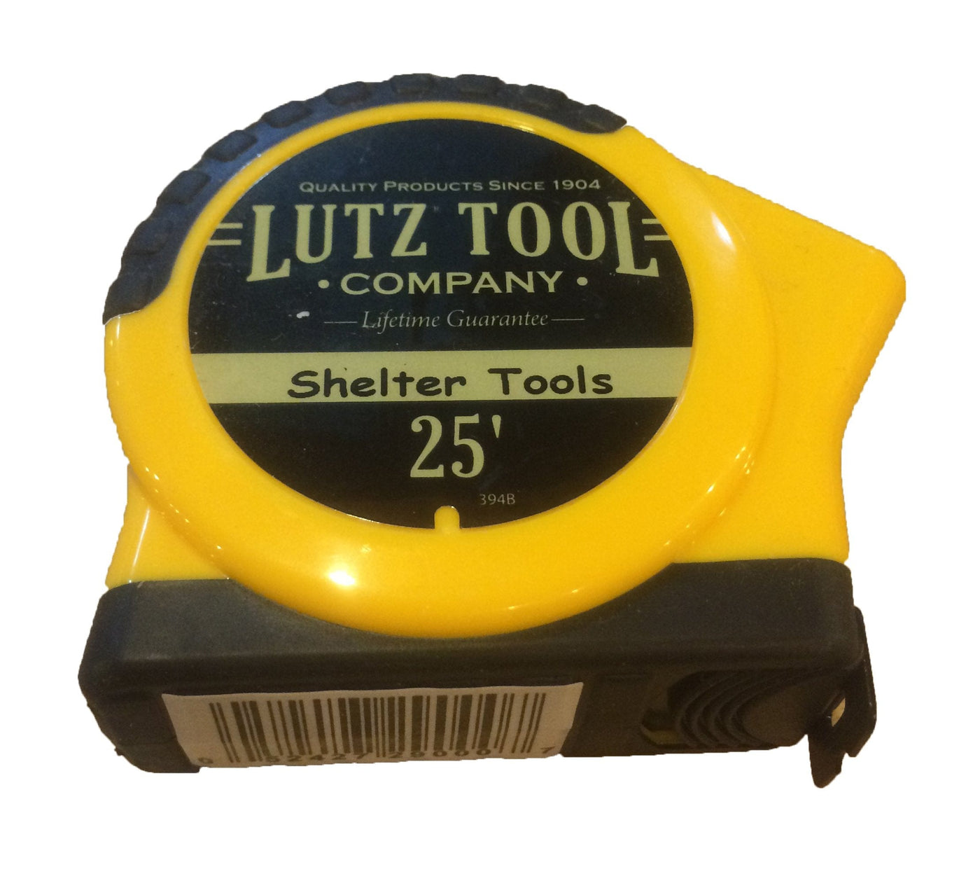A durable, yellow 25-ft tape measure from LUT, labeled "Shelter Tools," ensures accurate reading and features a barcode on the side.