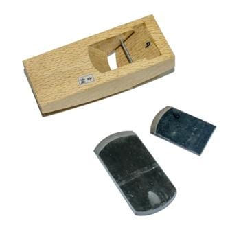 The MARU Compass Plane, meticulously crafted from Japanese White Oak, comes with two hand-forged lamination replacement metal blades displayed alongside.