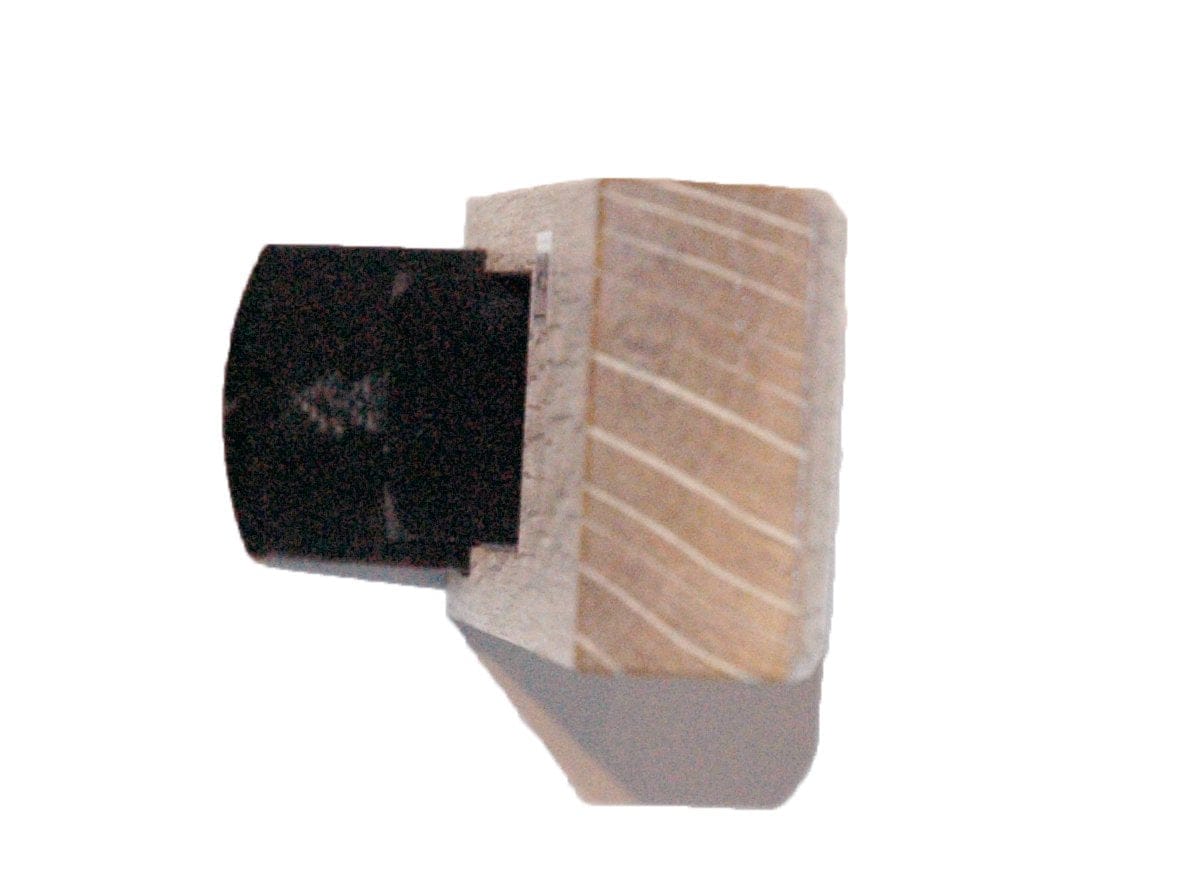 A close-up image of a wood and black plastic joint assembly, demonstrating the interlocking connection of the materials, featuring hand-forged lamination crafted from Japanese White Oak in the MARU Compass Plane.