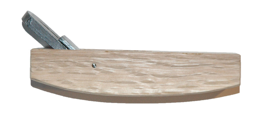 The Compass Plane by MARU is a wooden carpenter’s hand plane, crafted from Japanese White Oak with a sturdy metal blade protruding from the top.