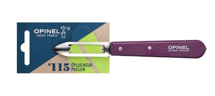 The Essential Stationary Peeler by Opinel, a must-have kitchen tool, has a purple handle and packaging with a durable stainless steel blade for efficient peeling.