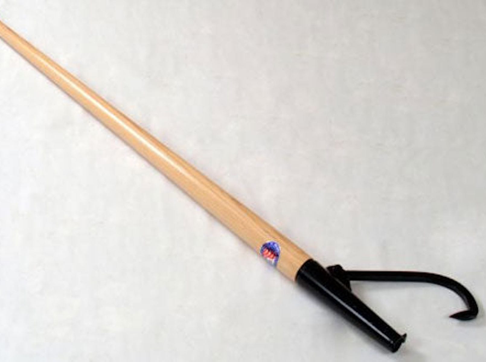 The PEA Peavey Cant Hook is a wooden tool featuring a sturdy hardwood handle and a metal hook at one end, ideal for pulling or pushing objects. Its design guarantees strength and reliability during heavy-duty tasks.