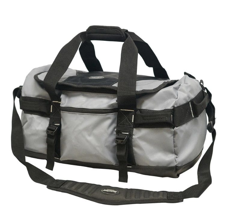 The Shelter Institute Duffel by PUL is a gray and black all-weather bag made from waterproof tarpaulin, featuring multiple pockets and an adjustable strap.