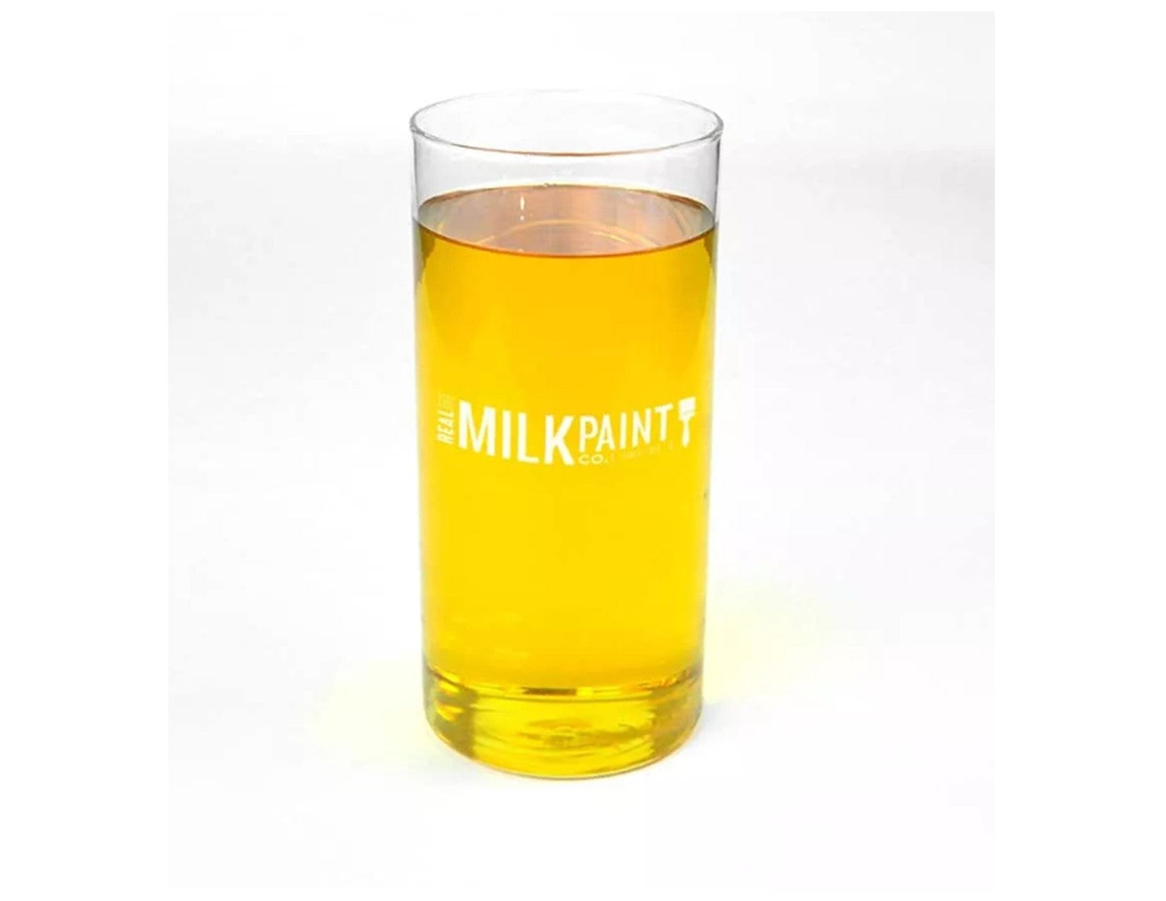 A clear glass filled with a yellow liquid, labeled "RMP," exudes the subtle scent of Citrus Solvent, promising a natural and fresh finish as part of their Half & Half Tung Oil product.