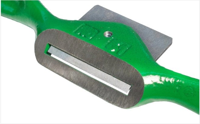 Close-up of the ROB Kunz Spokeshave Light Duty No 64, featuring a green frame and durable German steel blade, ideal for shaping and smoothing wood in woodworking projects. The sturdy metal frame holds the sharp blade securely.