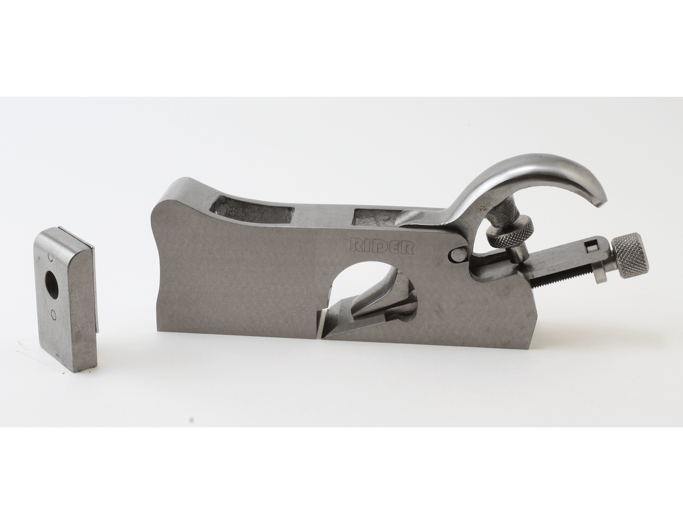 The image shows a ROB 3 In 1 Shoulder Plane hand tool with a curved handle, adjustment knob, and a detachable blade placed beside it on a white background.