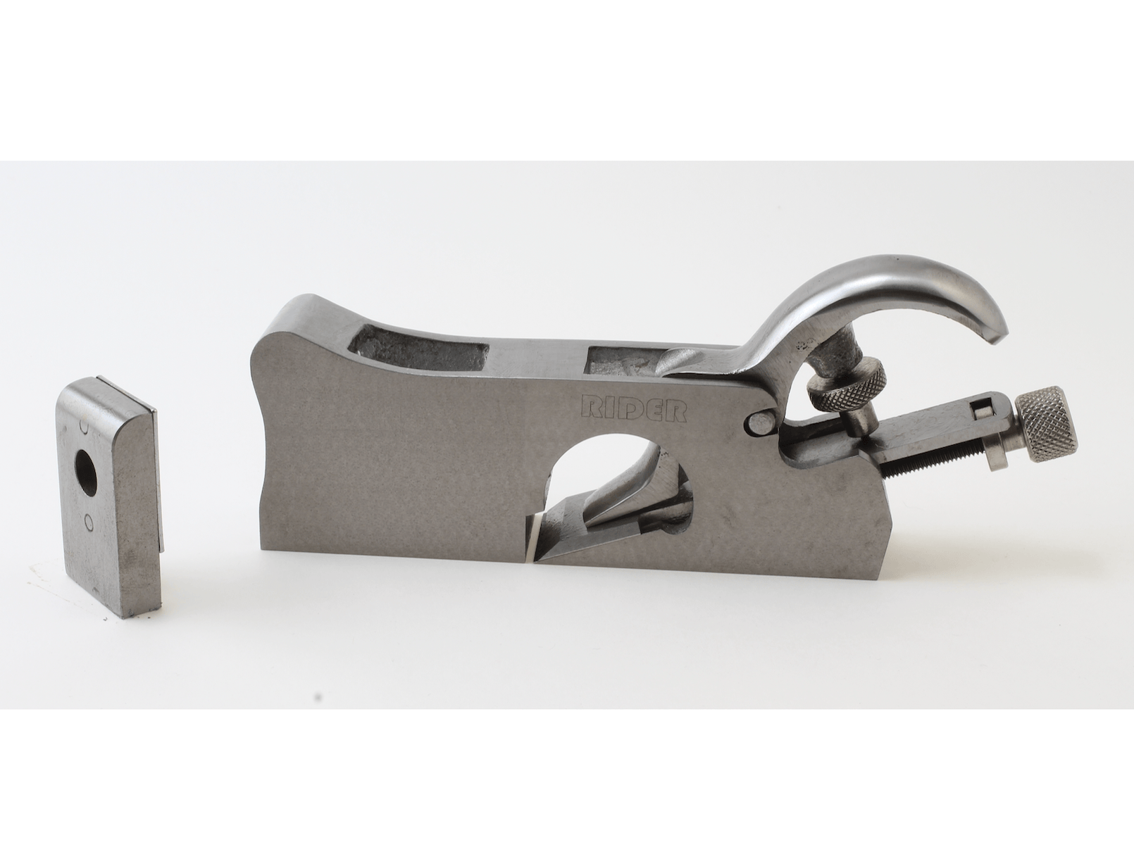 The image shows a ROB 3 In 1 Shoulder Plane hand tool with a curved handle, adjustment knob, and a detachable blade placed beside it on a white background.