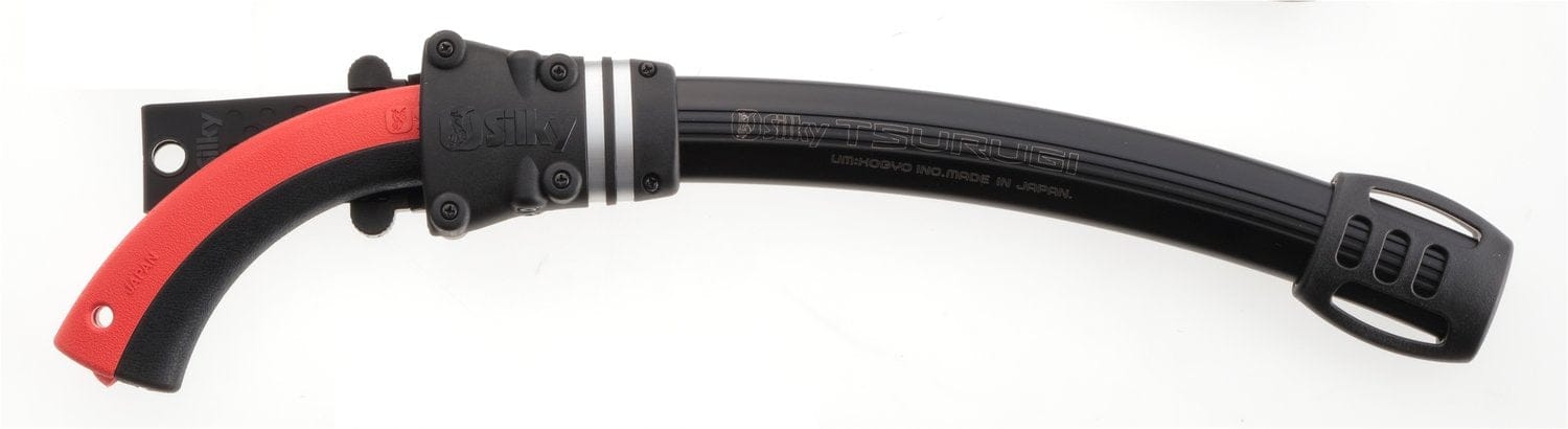 The SHT Tsurugi Arborist Saw 375 mm features a curved blade with impulse hardening, a black handle with red grip, and comes with a ventilated black sheath for durability.