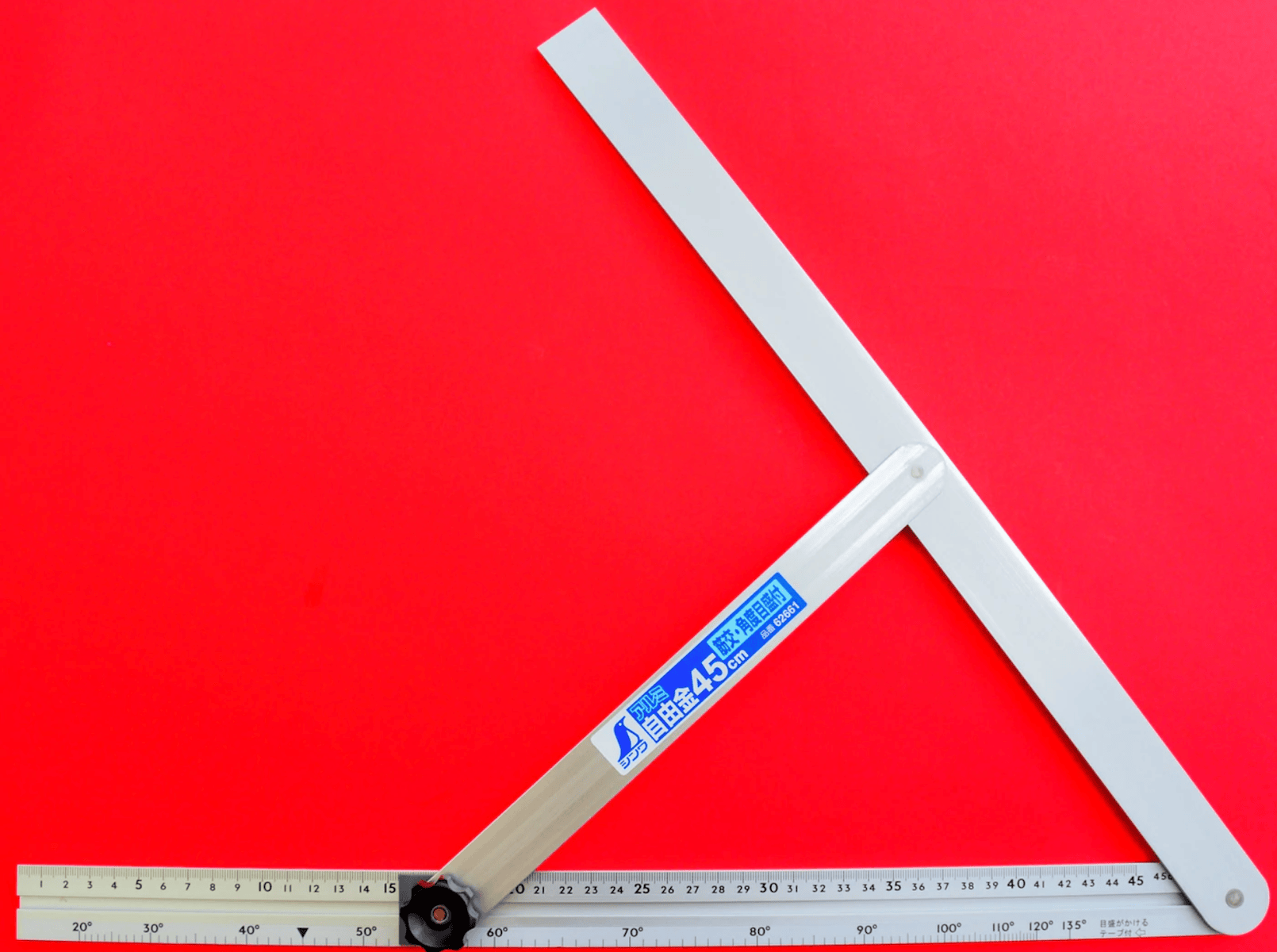 The Shinwa Aluminum Sliding Bevel with Angle Scale by SHWA is displayed on a red background, featuring accurate measurements and a built-in protractor, perfect for checking angles.