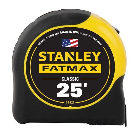 A STN Stanley FatMax 25-foot tape measure, featuring a durable rubber outer casing and a distinctive black and yellow design, proudly labeled "Made in USA with Global Materials.