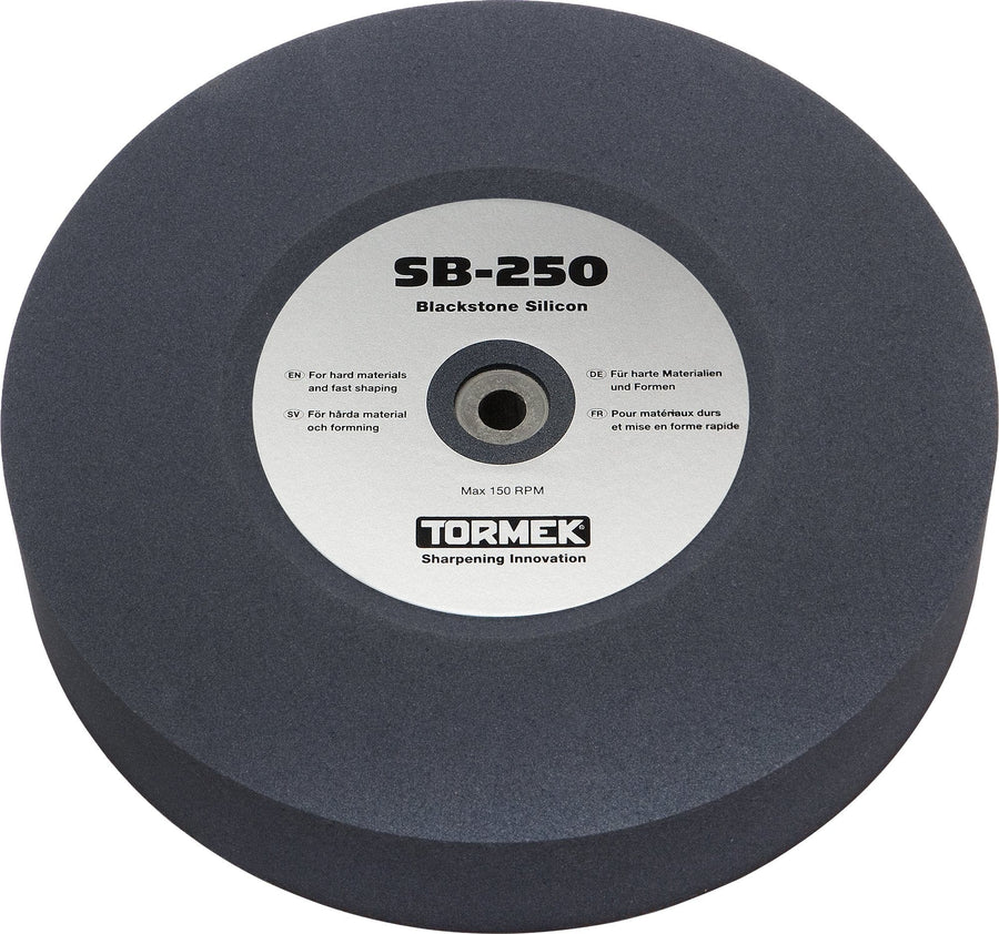 The TOR Tormek Blackstone Silicon sharpening wheel is circular and gray, perfect for HSS sharpening and tungsten carbide touch-up at up to 150 RPM, with specifications in several languages.