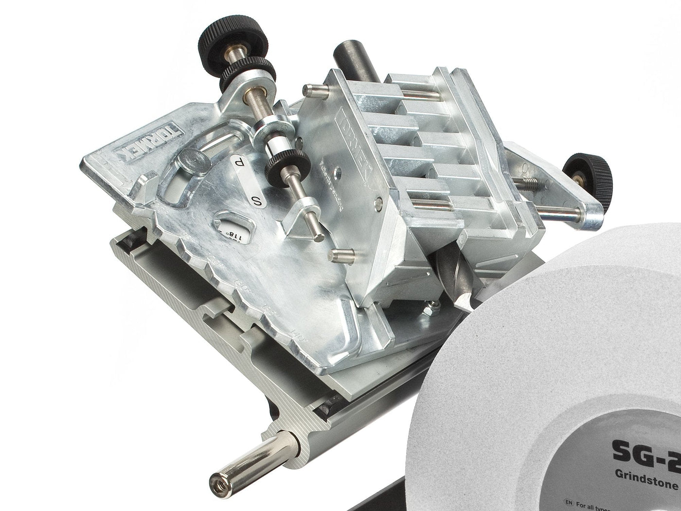 Close-up of a Tormek Drill Bit Sharpening Attachment by TOR on an SG-250 grindstone. It includes adjustment knobs for precision and is ideal for sharpening drill bits with a 4-facet point.