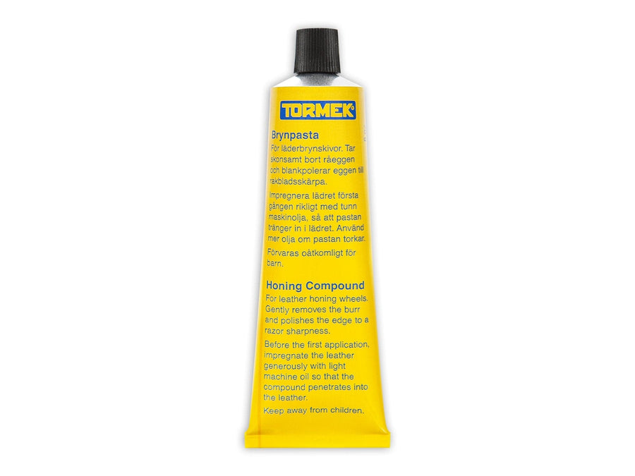 A yellow tube of TOR Tormek Honing Compound for leather honing wheels with micro abrasives, clear Swedish and English instructions, and a black cap.