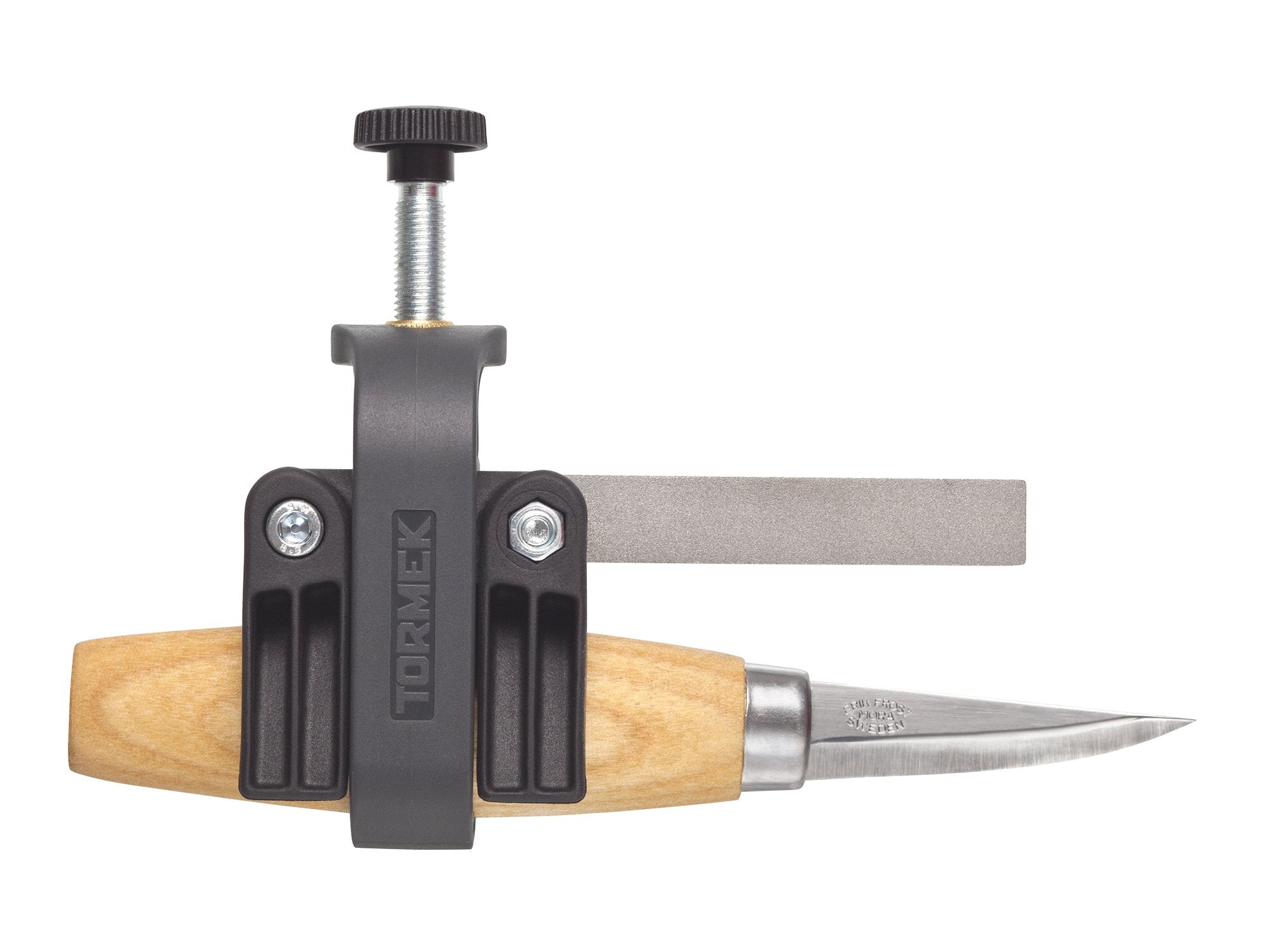 A carving knife with a wooden handle is secured in the TOR Tormek Small Knife Holder, easily attached to a flat sharpening stone to sharpen small knife blades with precision.