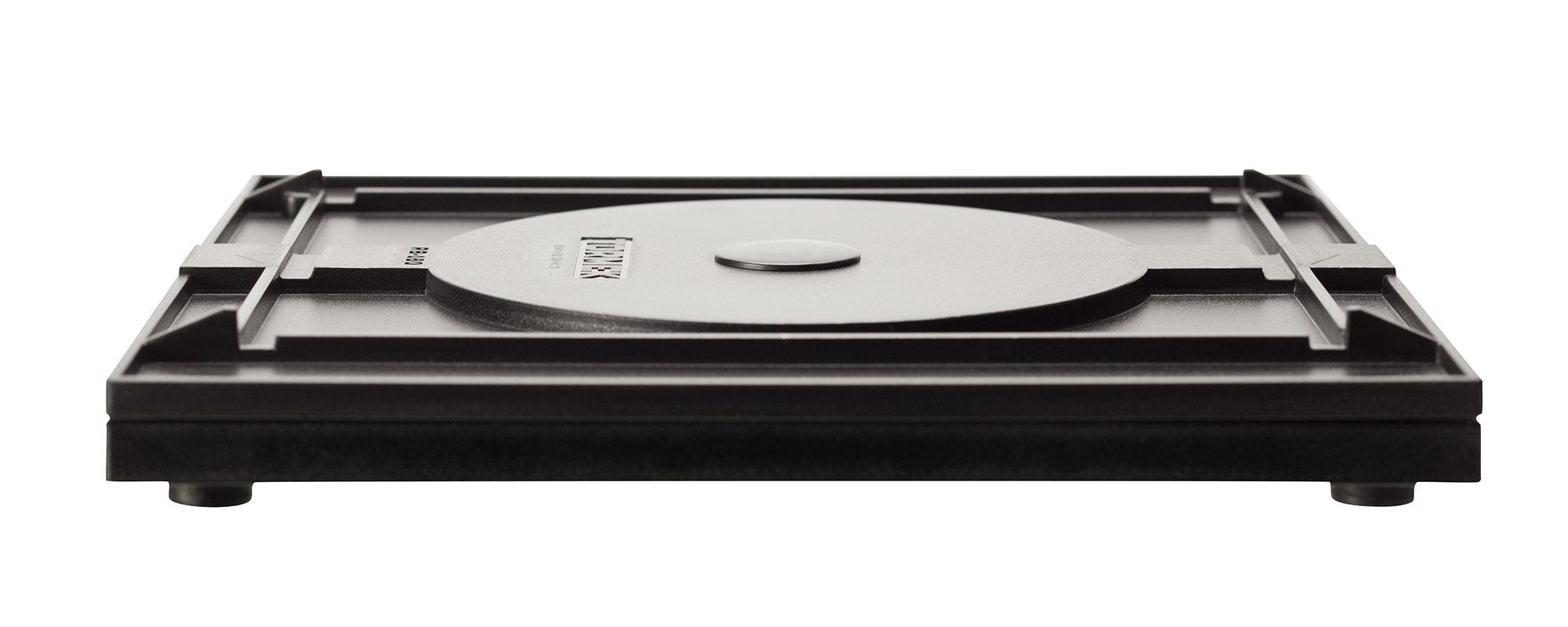 The Tormek Rotating Base by TOR features a black square metal design with a central circular section, crafted with precision comparable to sharpening a blade. It stands on four short legs, highlighting its sleek design and ensuring effortless use.