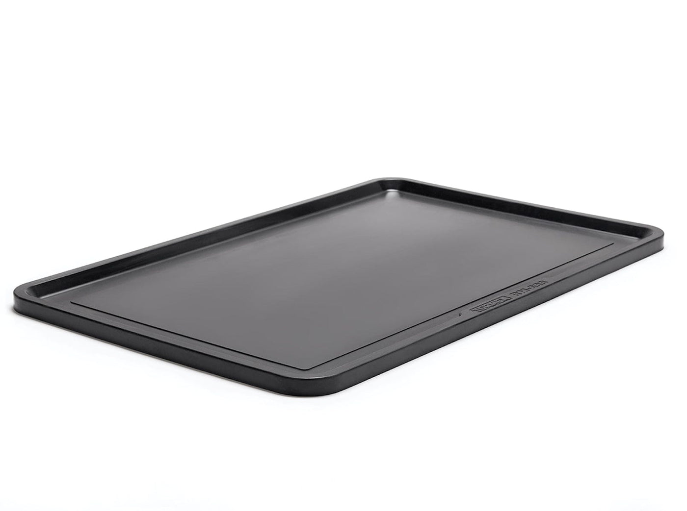 The Tormek Rubber Work Mat by TOR is a rectangular black tray with raised edges, designed with a non-slip surface for stability, and is shown lying flat on a white background.