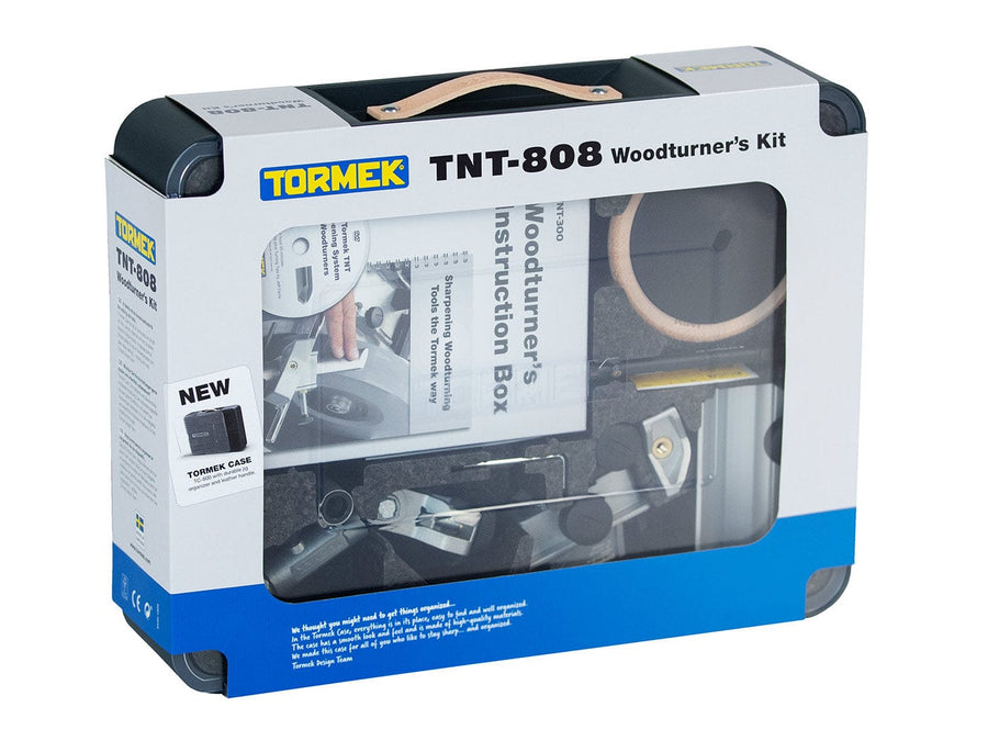 The TOR Tormek Woodturners Kit in its original packaging, featuring various woodturning tools and an instruction box visible through the transparent front, is an essential sharpening kit for any craftsman.