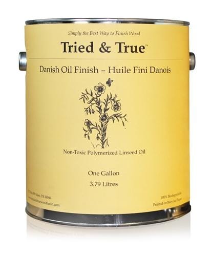 A gallon can of TRD Tried & True Danish Oil Finish, featuring a floral design on a yellow background, is labeled as a non-toxic linseed oil finish.