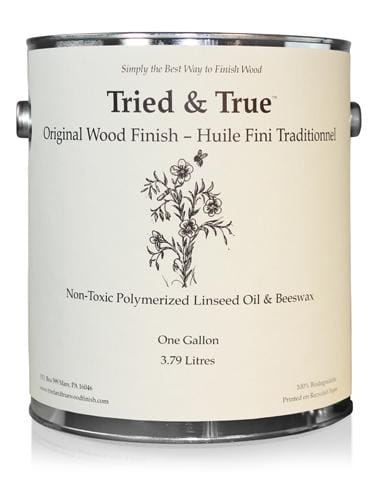 A one-gallon can of TRD Tried & True Original Wood Finish, crafted from a blend of linseed oil and beeswax for exceptional interior wood protection. The label showcases a floral illustration along with product details.