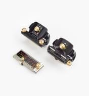 Three compact mechanical devices from the VER MKII DELUXE HONING GUIDE SET appear on a white background—two black with gold knobs and one silver with dark accents—perfect for setting precise blade angles when sharpening.