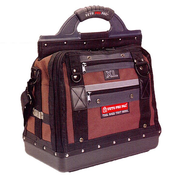 A brown and black VET Extra Large Compact Tool Bag with rugged materials, sturdy handle, side strap, metal studs, maximized pocket storage, and a visible label reading Tool Bags That Work.