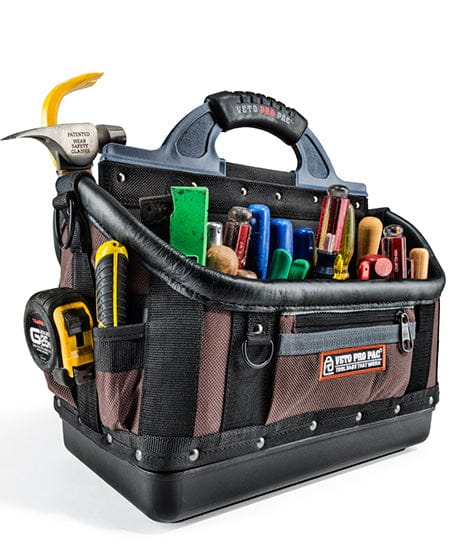 The VETO Pro Pac OT-XL by VET is an extra-large tool bag made from rugged materials, offering essentials like a hammer, screwdrivers, pliers, and a measuring tape, all secured under a top sturdy handle.